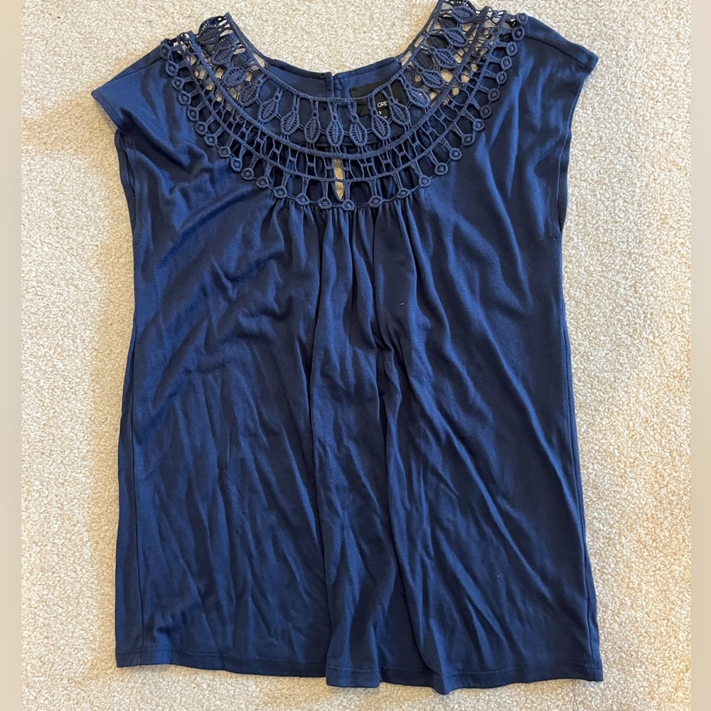 Navy top with shoulder/neck detailing